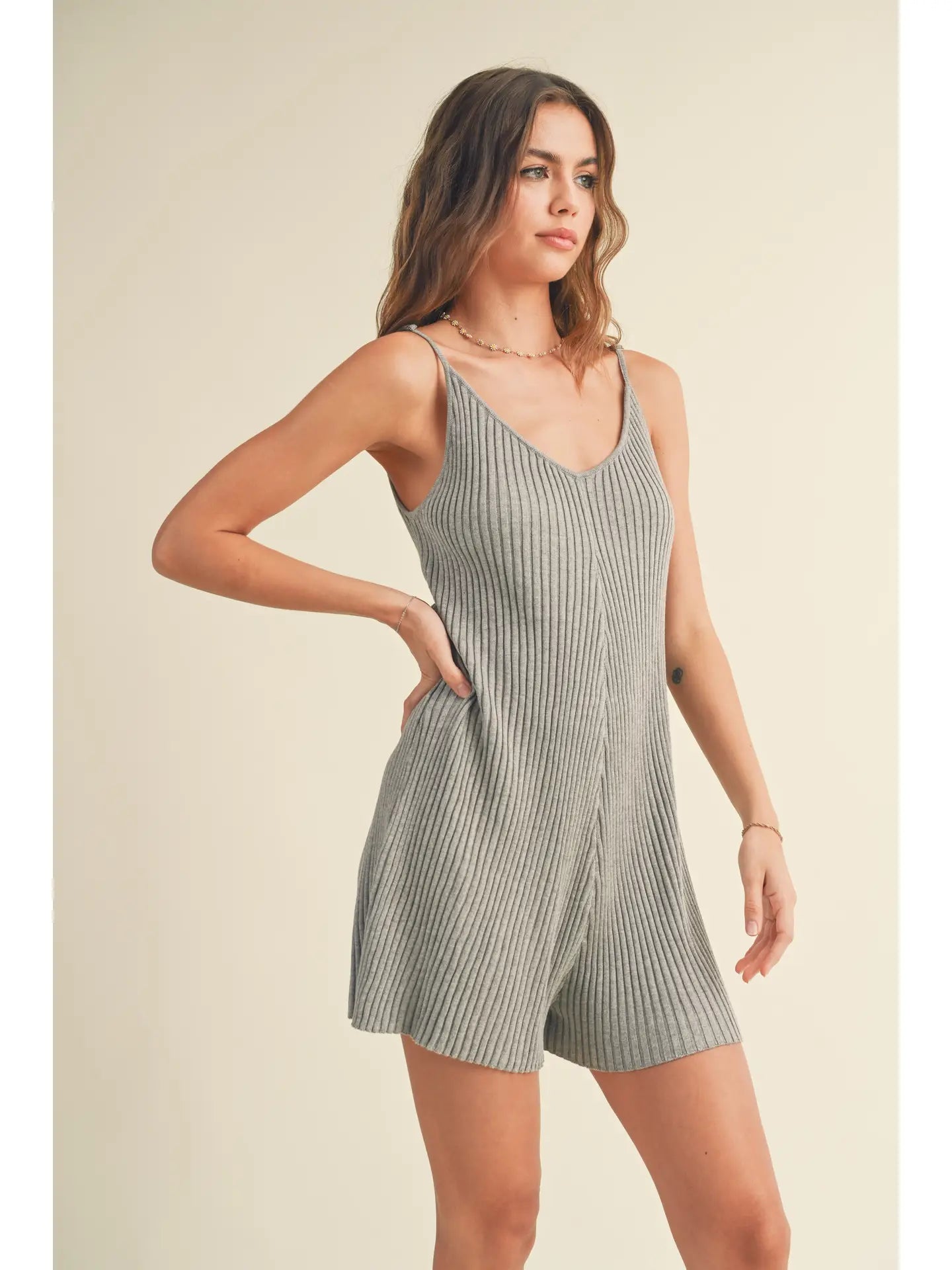 Model wearing a Ribbed Knitted Romper, showcasing its soft knit fabric and flattering fit.