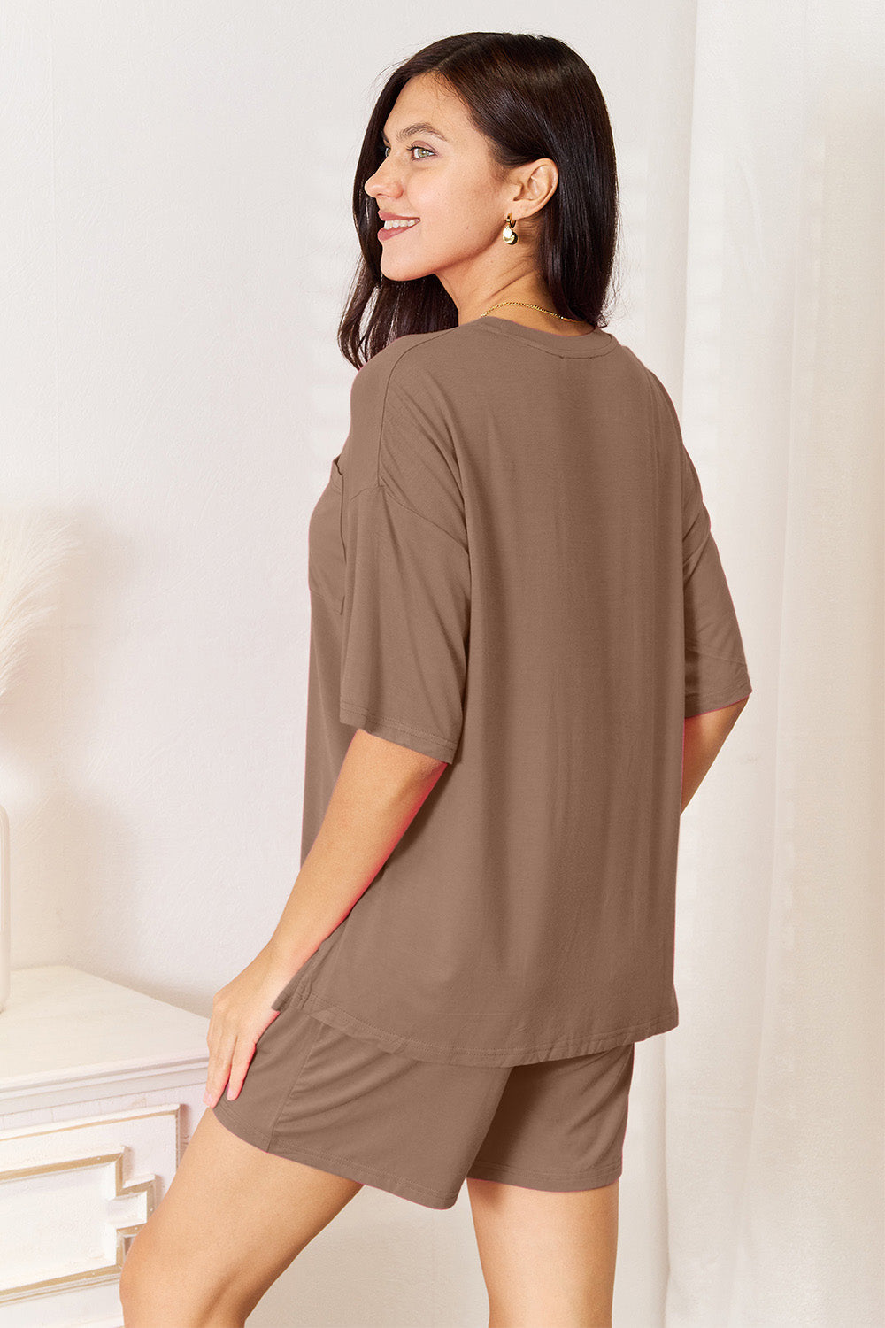 Model wearing Basic Bae soft rayon half sleeve top and shorts set in taupe color, showcasing a relaxed and stylish look.