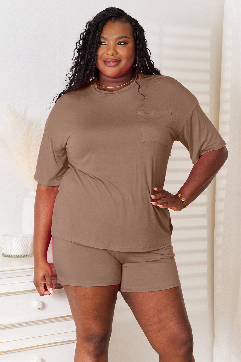 Basic Bae full size soft rayon half sleeve top and shorts set in brown, featuring relaxed fit and elastic waist.