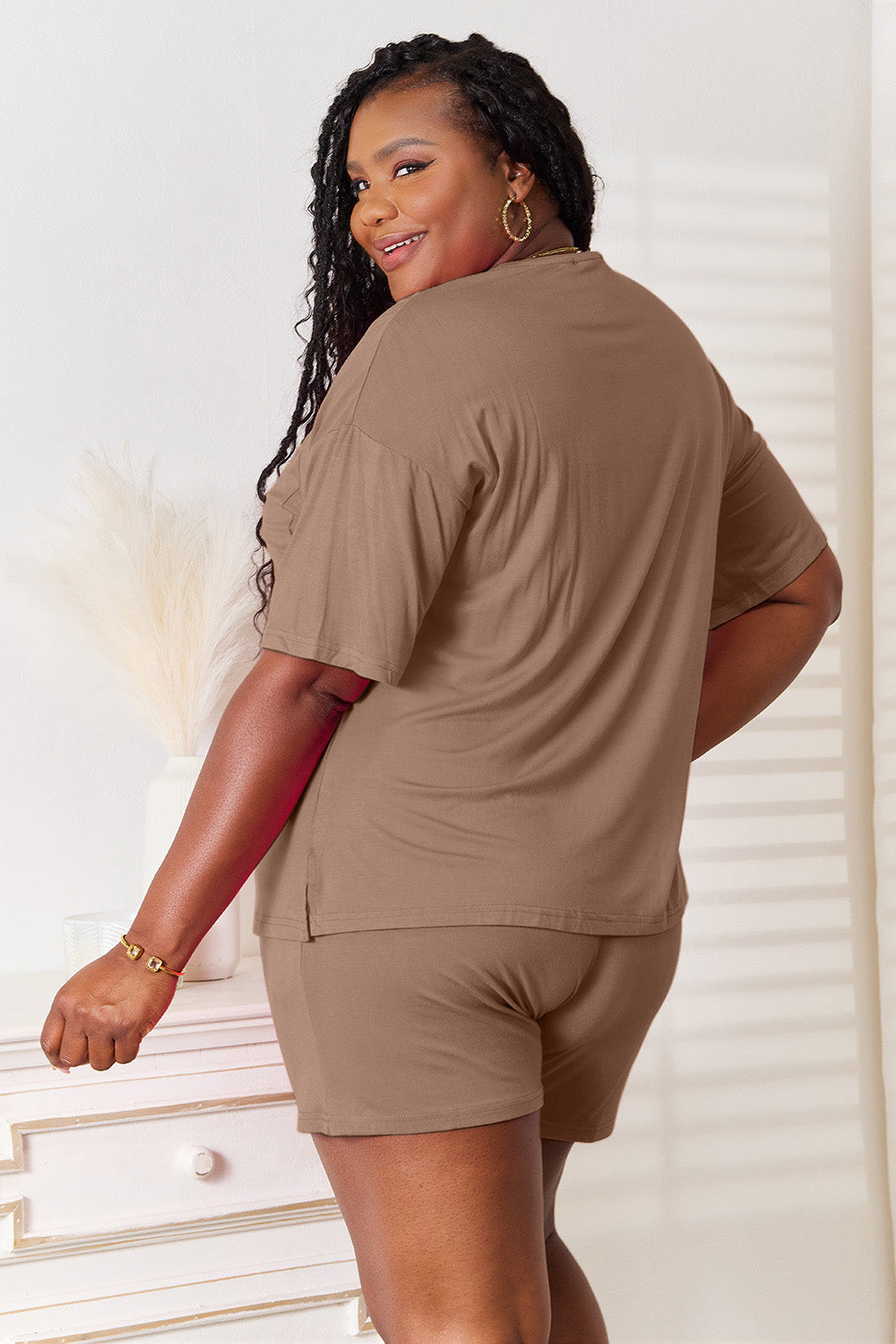 Model wearing Basic Bae soft rayon half sleeve top and shorts set in brown, showcasing a relaxed and stylish look.