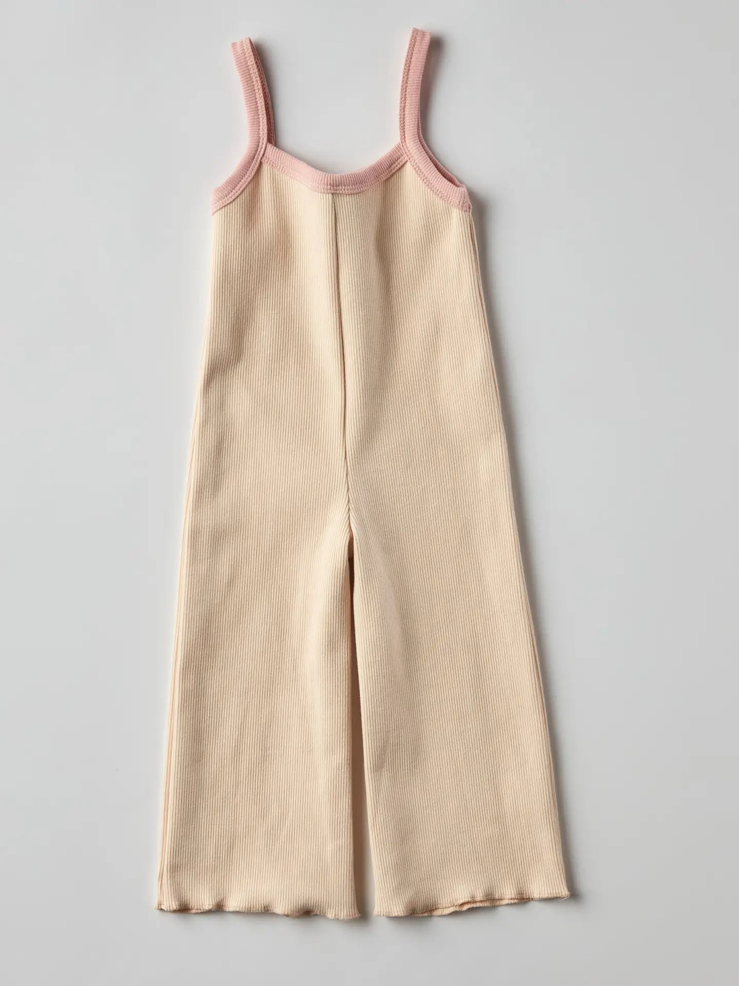 Eloise ribbed jumpsuit in cream with pink straps, ideal for cozy baby outfits and minimalist fashion.