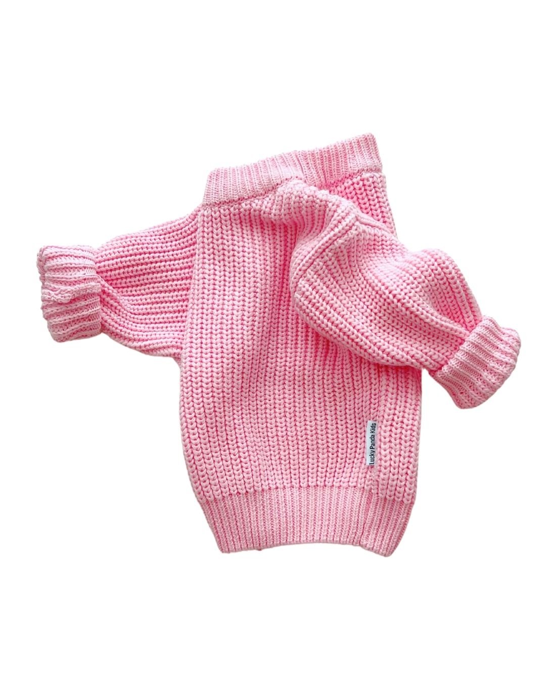 Chunky Knit Sweater in pink, featuring a relaxed fit and soft cotton texture, perfect for stylish layering.