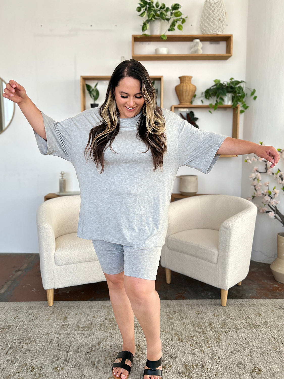 Model wearing Basic Bae Bamboo oversized T-shirt and shorts set, showcasing cozy style and comfort for everyday wear.