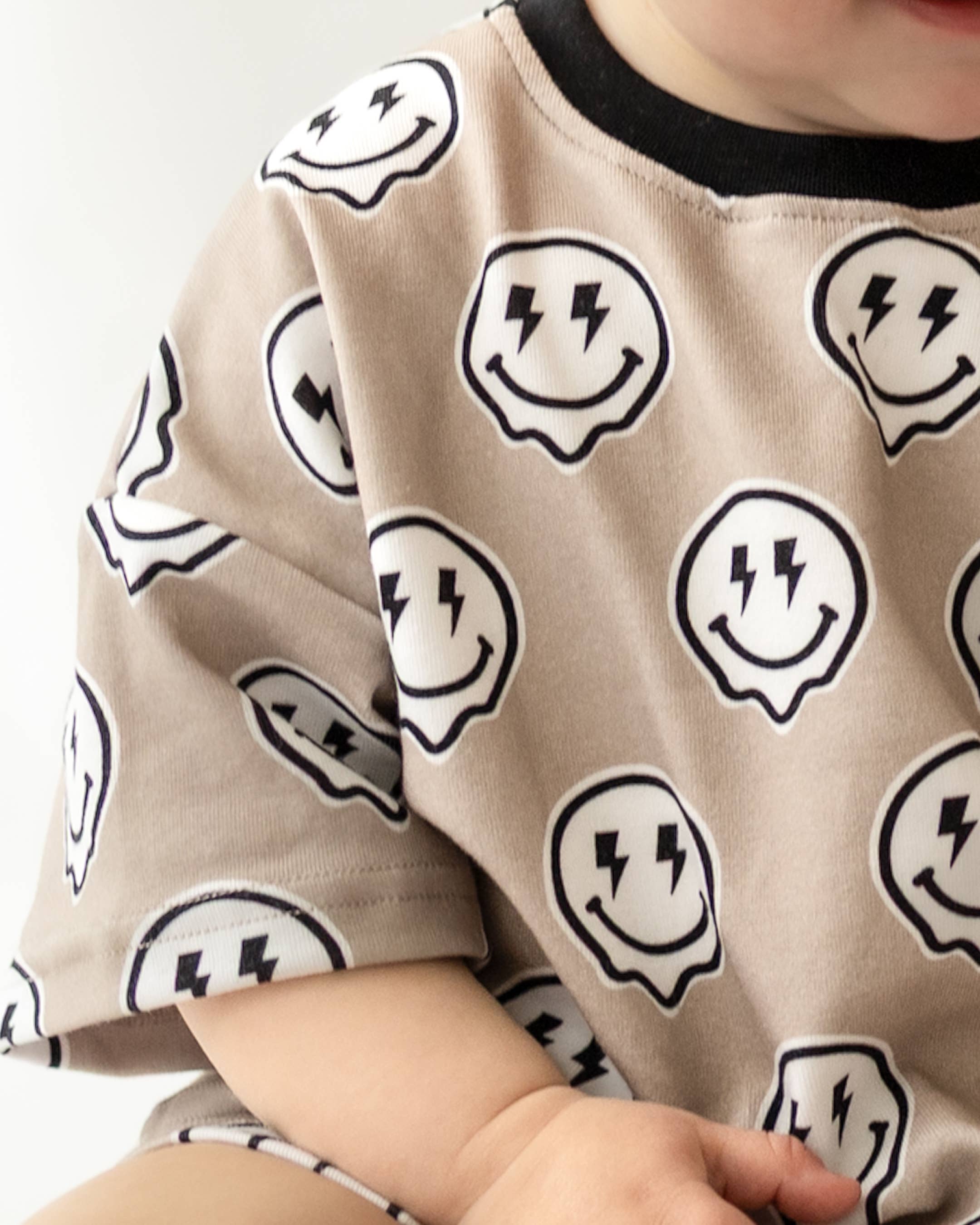 Electric Drippy toddler shorts set featuring a bold smiley face print on a relaxed-fit tee.