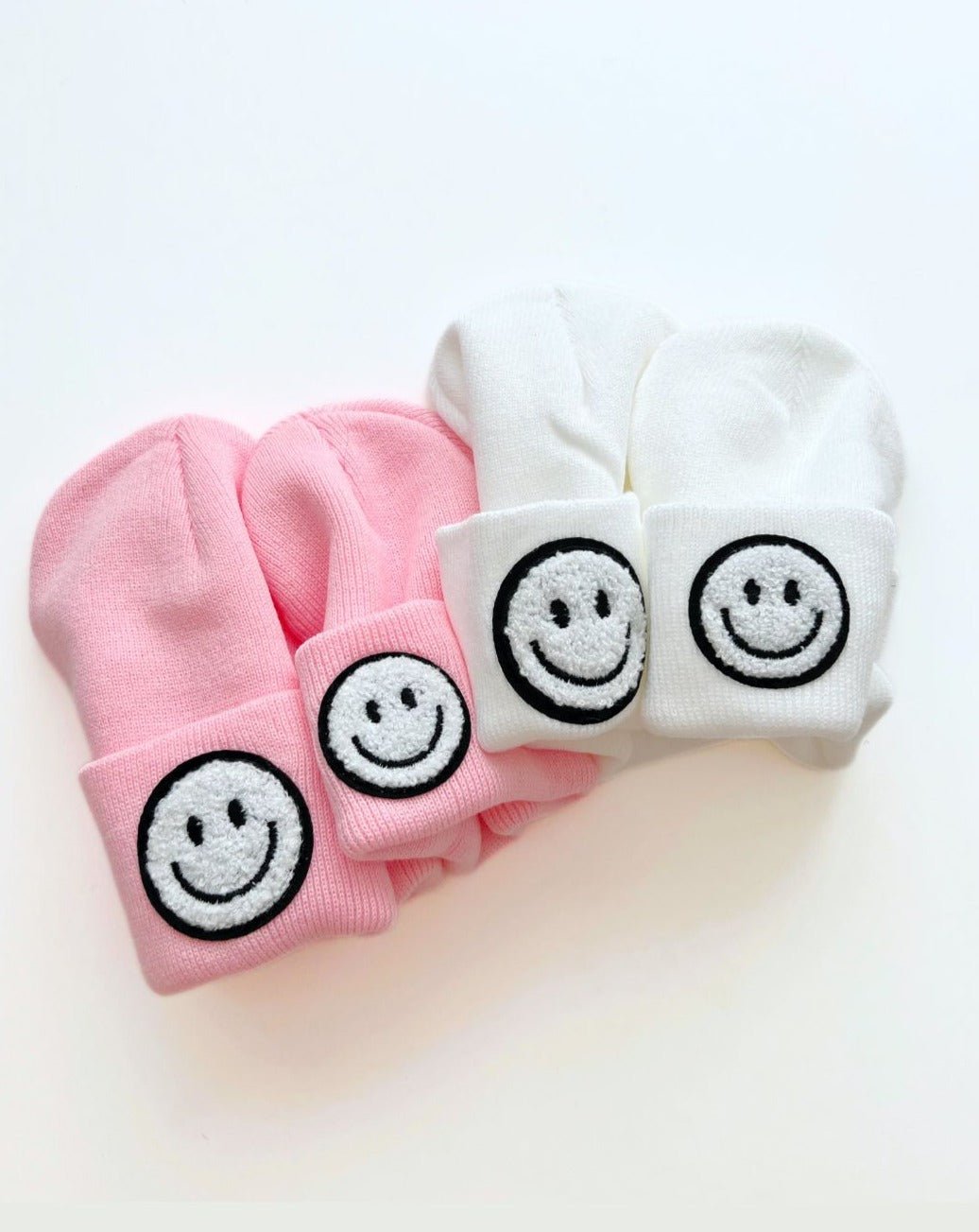 Smiley Beanie set in pink and white featuring embroidered smiley faces for kids and toddlers.