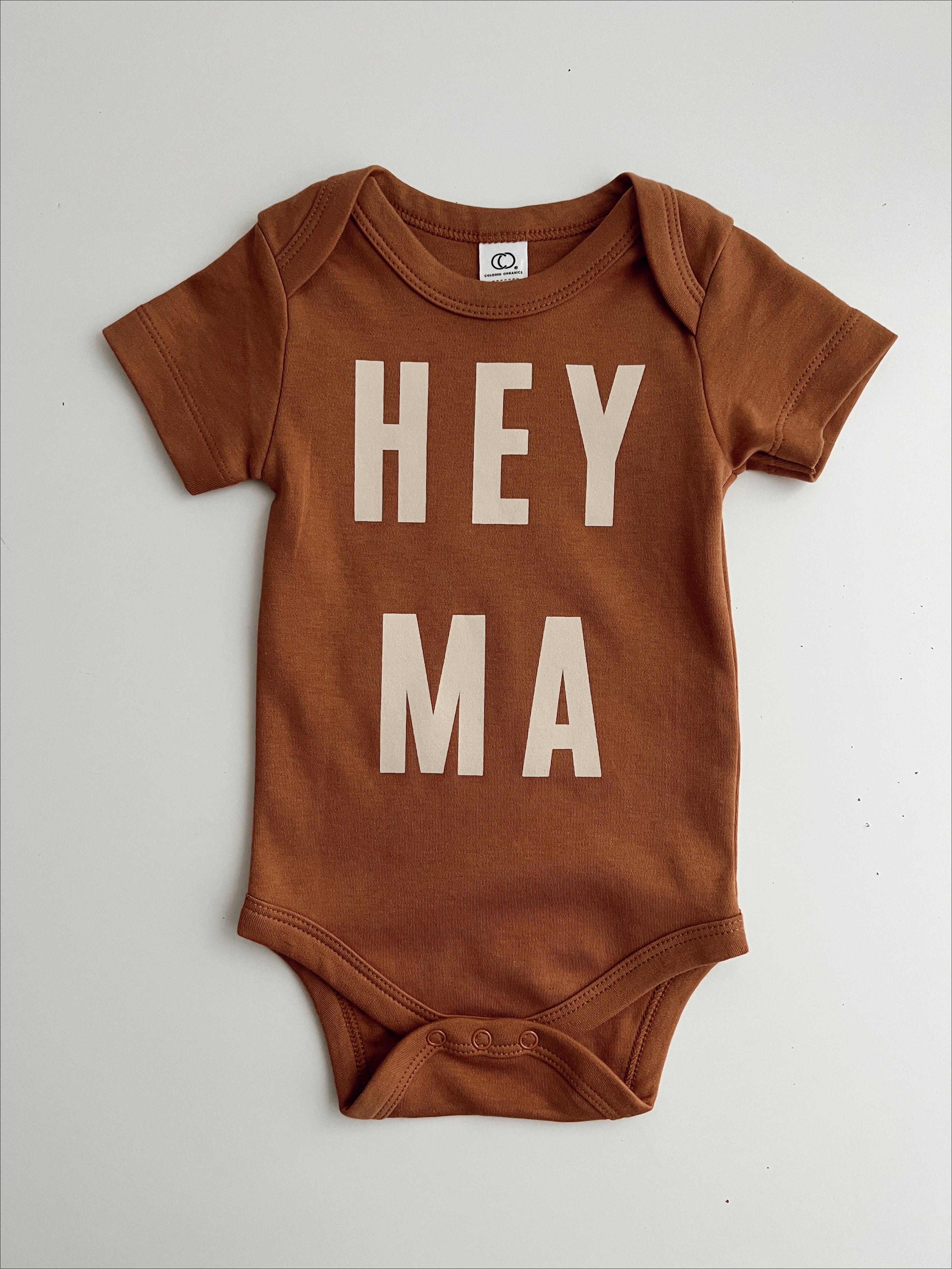 Hey Ma organic baby onesie in warm brown, soft cotton, trendy design, perfect for cool moms and baby shower gifts.
