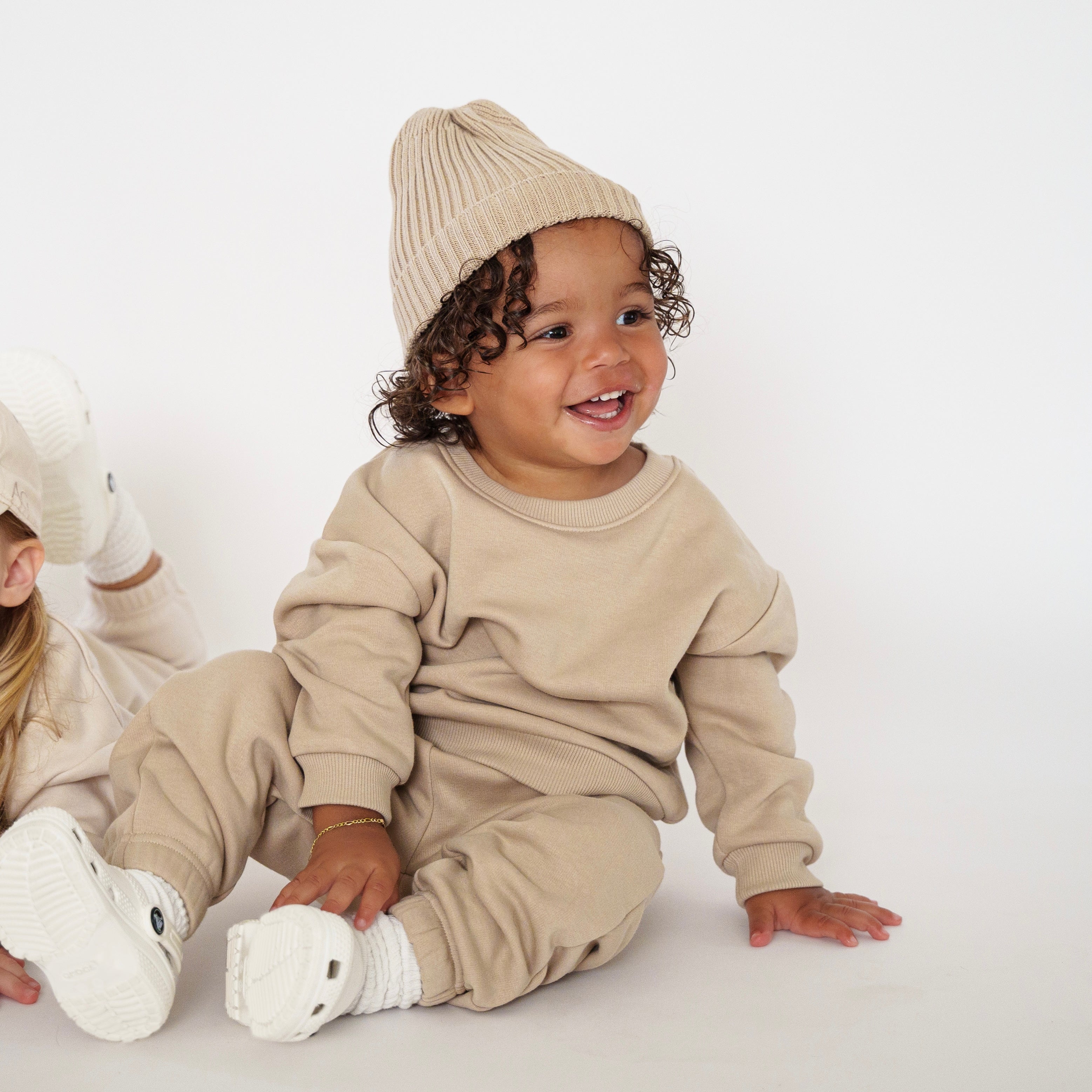 Fleece Sweat Set - Ultra-Soft Neutral Lounge Set for toddlers, featuring a cozy beige outfit and a knit hat.