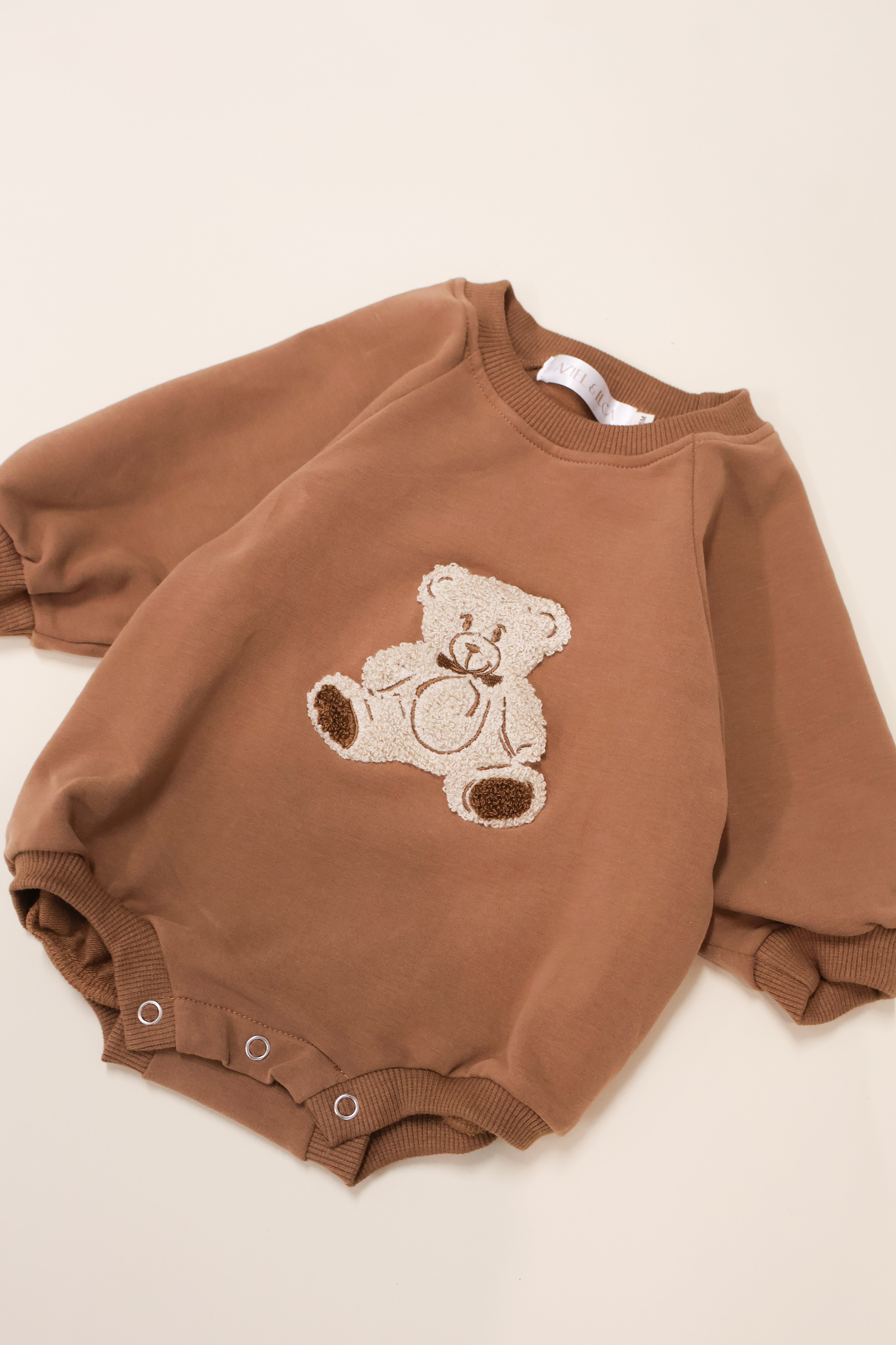Cute brown Bear Bubble Romper with soft teddy bear embroidery, designed for comfort and easy play.
