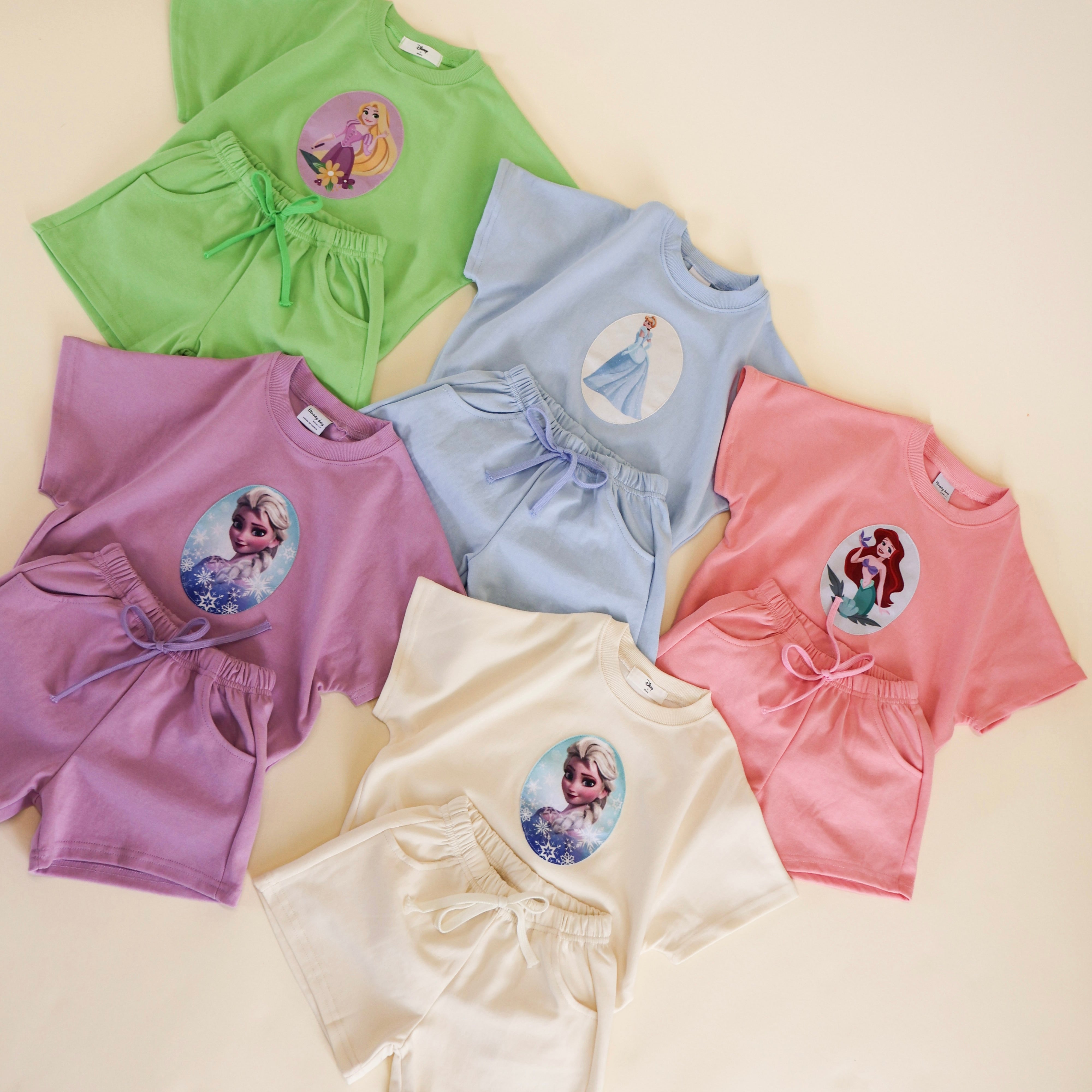 Colorful princess short sets for toddlers featuring Disney princess designs, perfect for little fashionistas.
