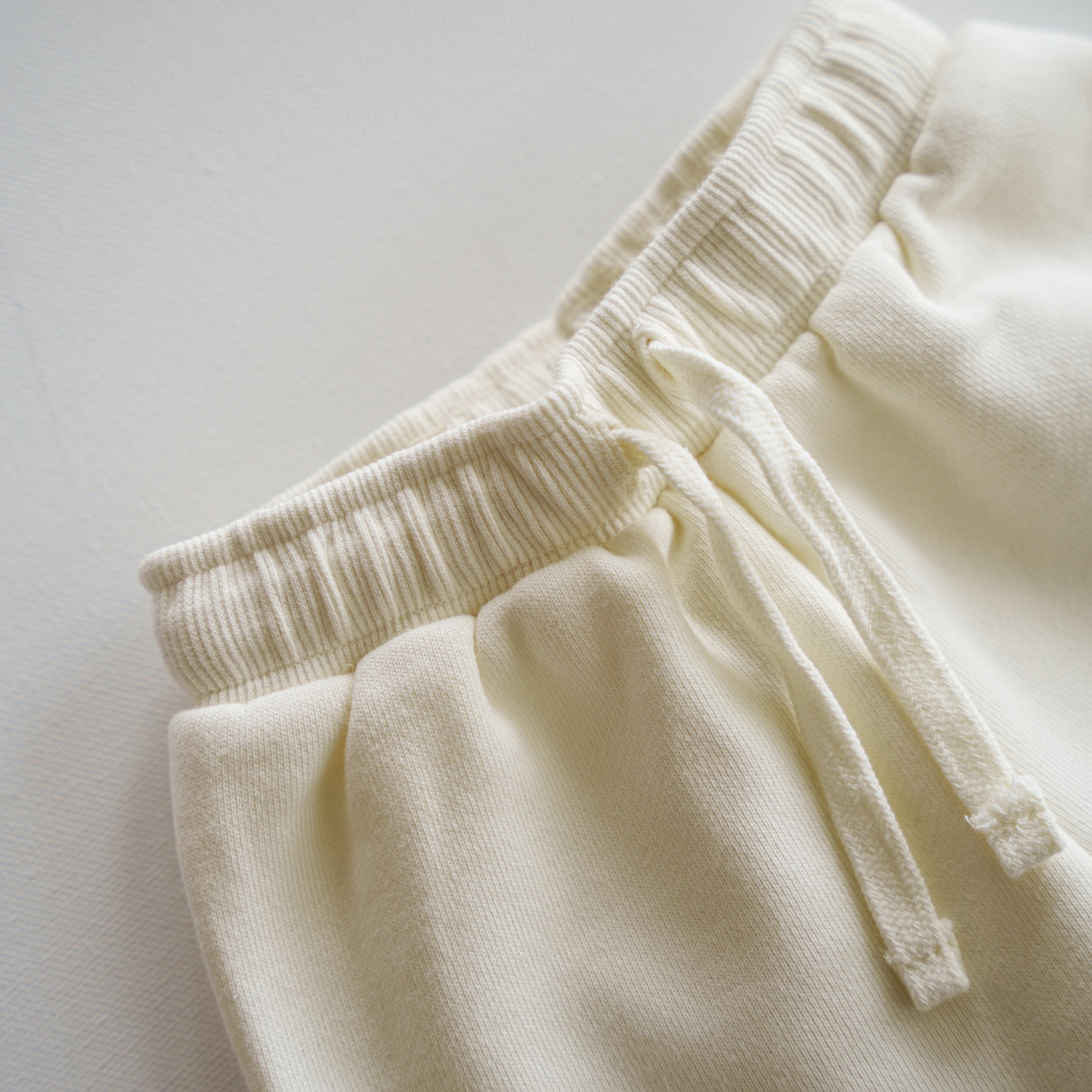 Oversized Sweatpant waistband detail showing soft elastic and drawstring for comfortable fit.
