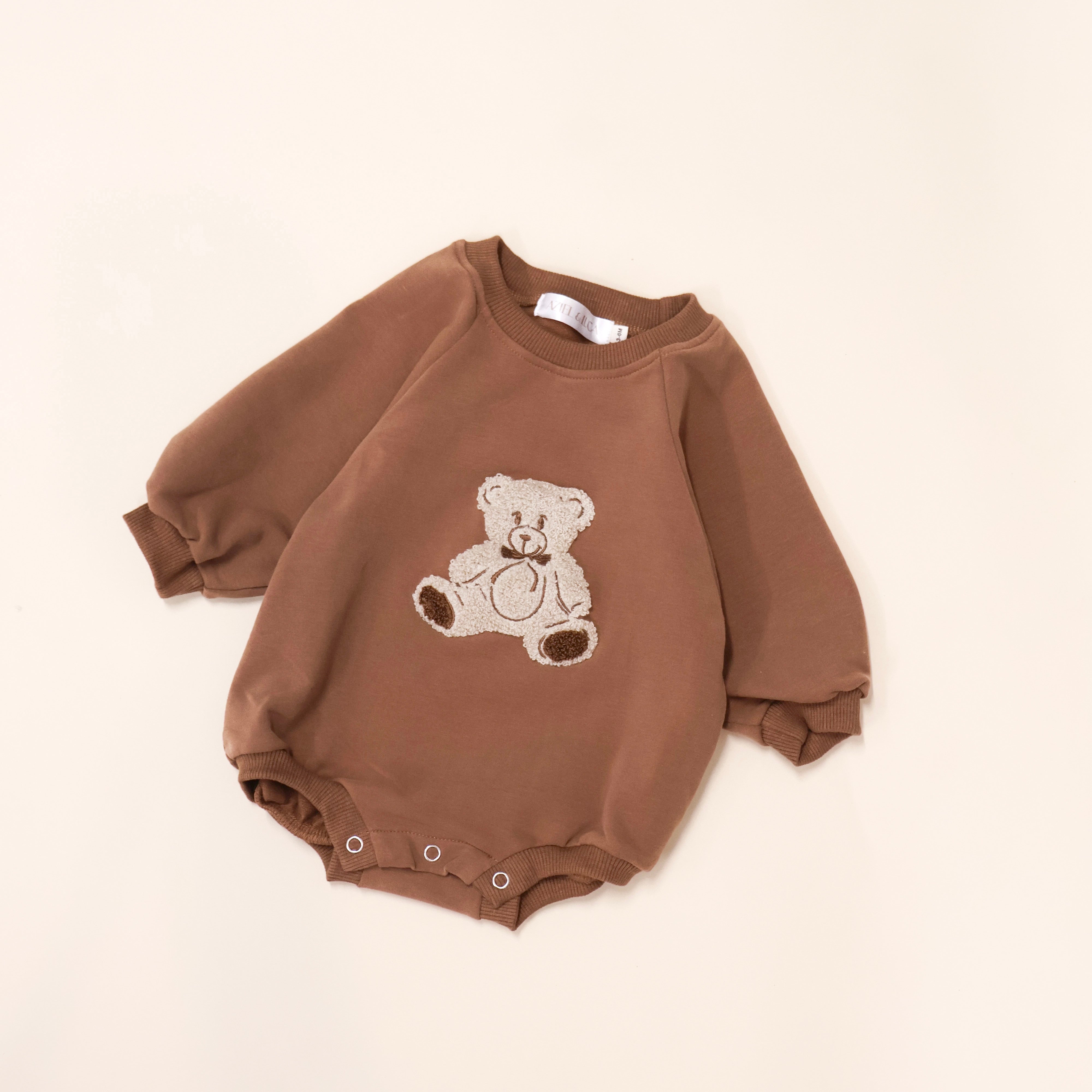 Bear Bubble Romper in brown with teddy bear embroidery, soft terry fabric for kids' comfort and play.