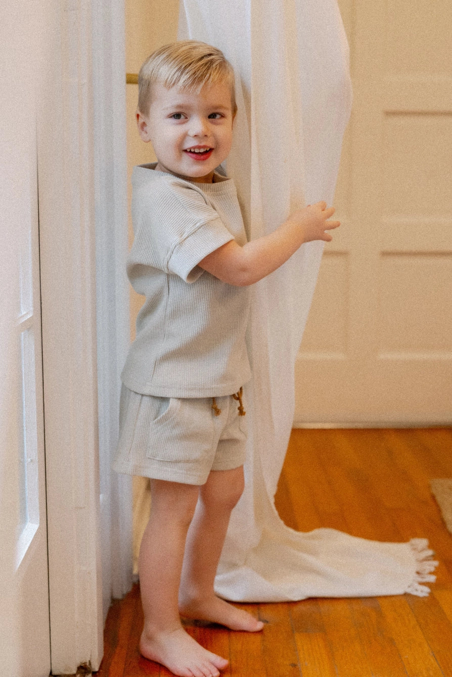 Toddler wearing light grey Oakley waffle set, featuring soft waffle knit fabric for kids' loungewear.