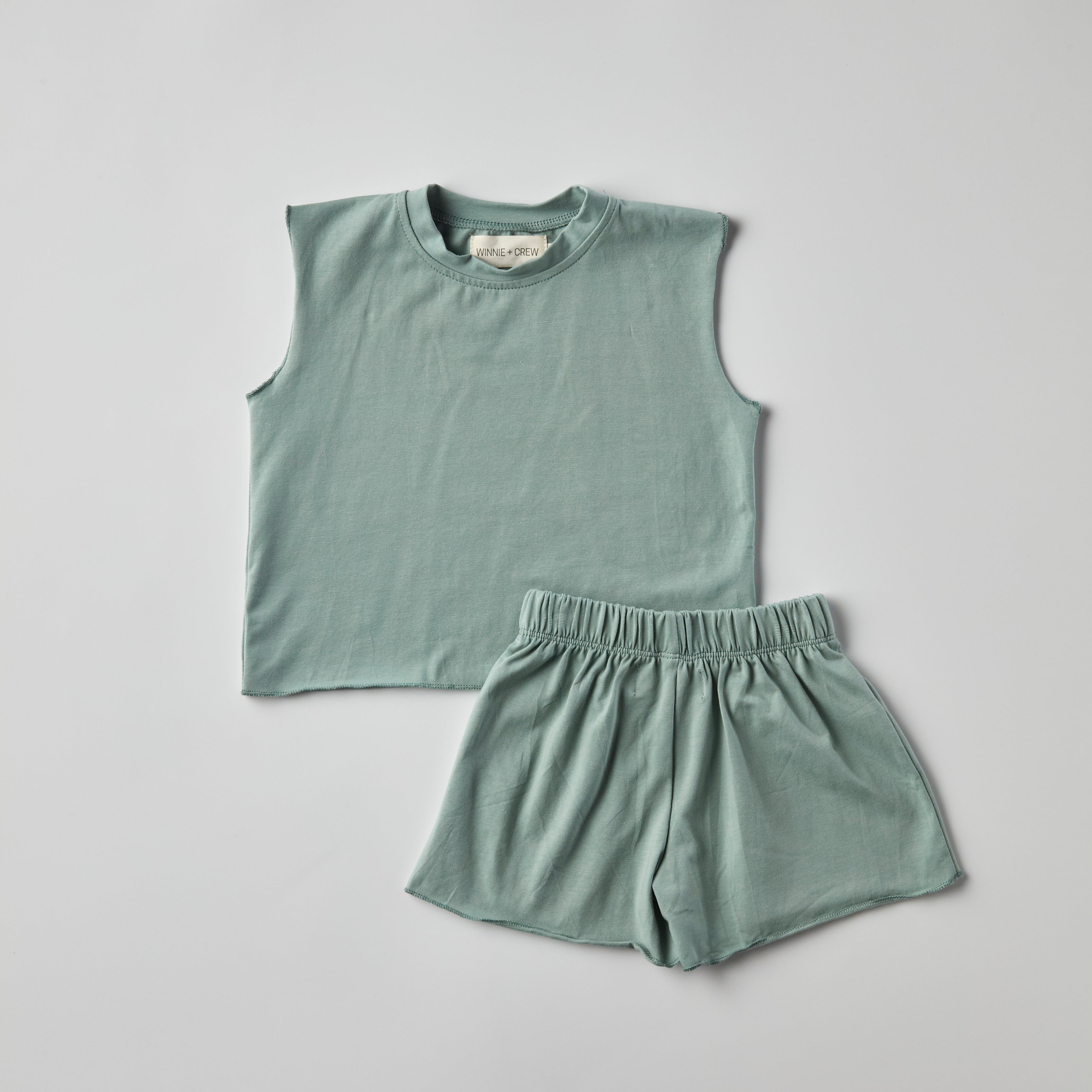 Teal two-piece baby outfit featuring soft cotton tee and shorts, perfect for comfy, everyday wear.