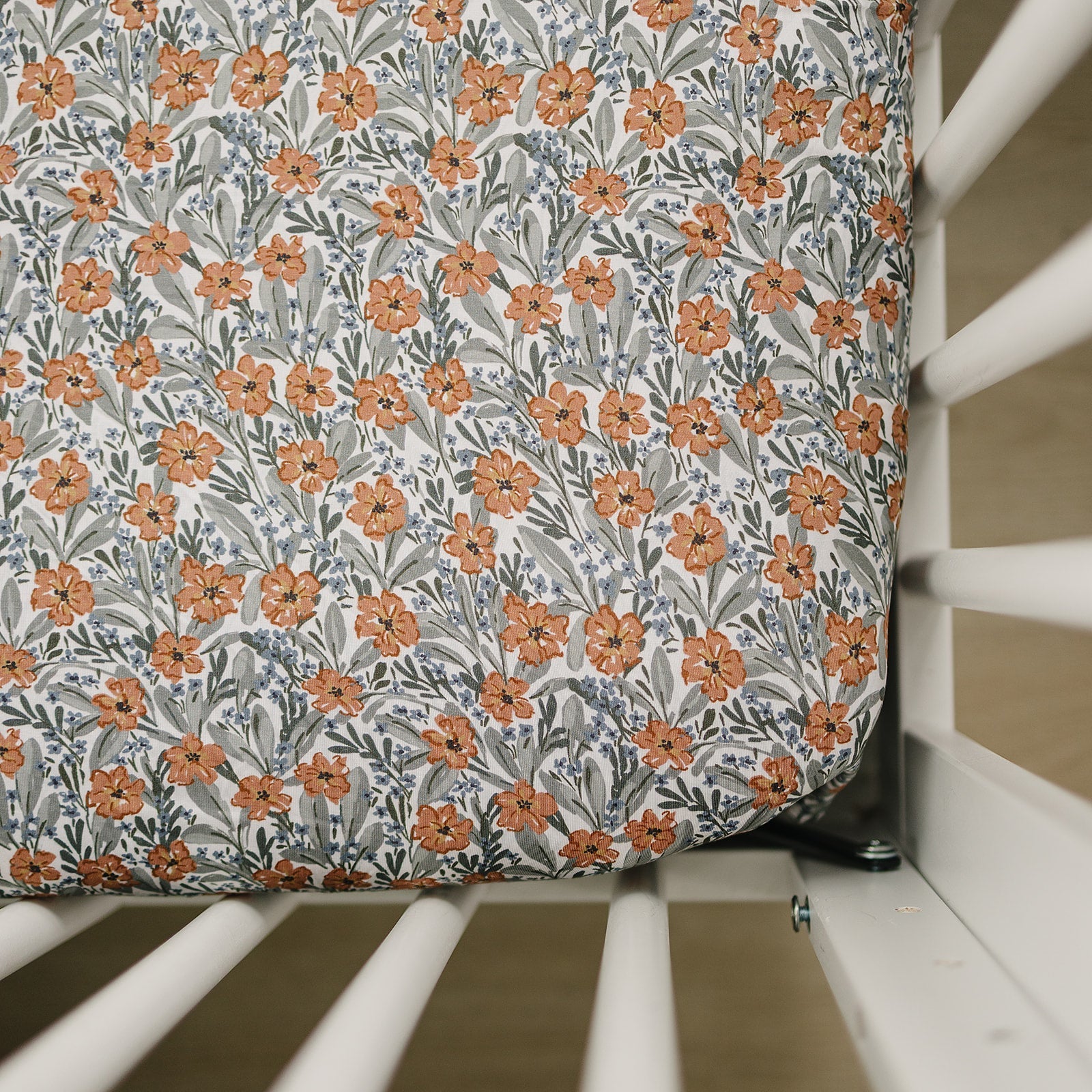 Bamboo crib sheet featuring dainty meadow floral design, perfect for nursery decor.