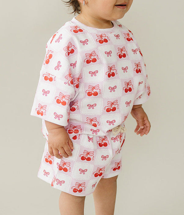 Checkered Cherry Shorts Set for kids featuring playful cherry print and elastic waist design, ideal for summer outings.
