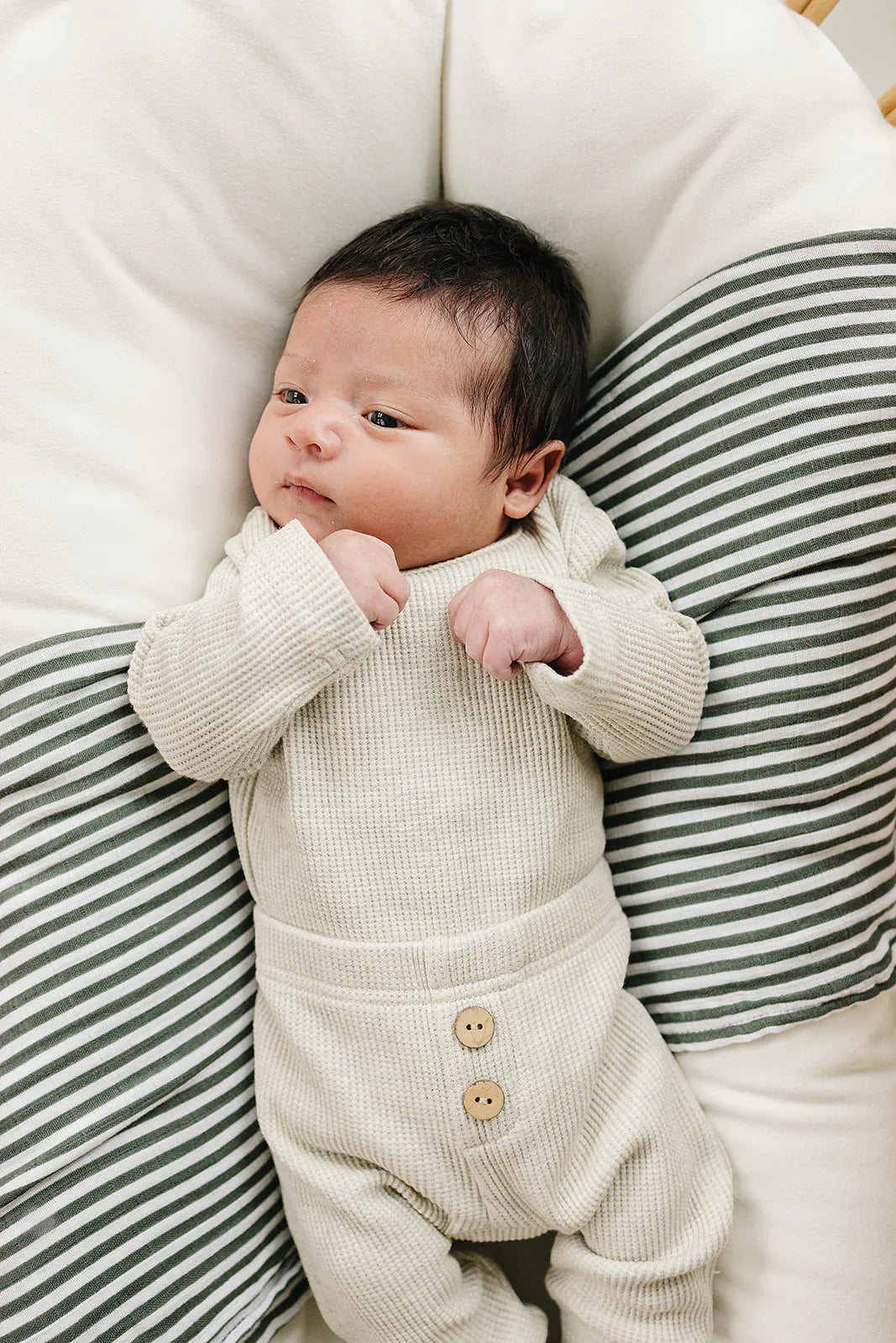Waffle Knit Baby Bodysuit Set – Heather Grey on a cozy cushion, featuring a soft design for infants.