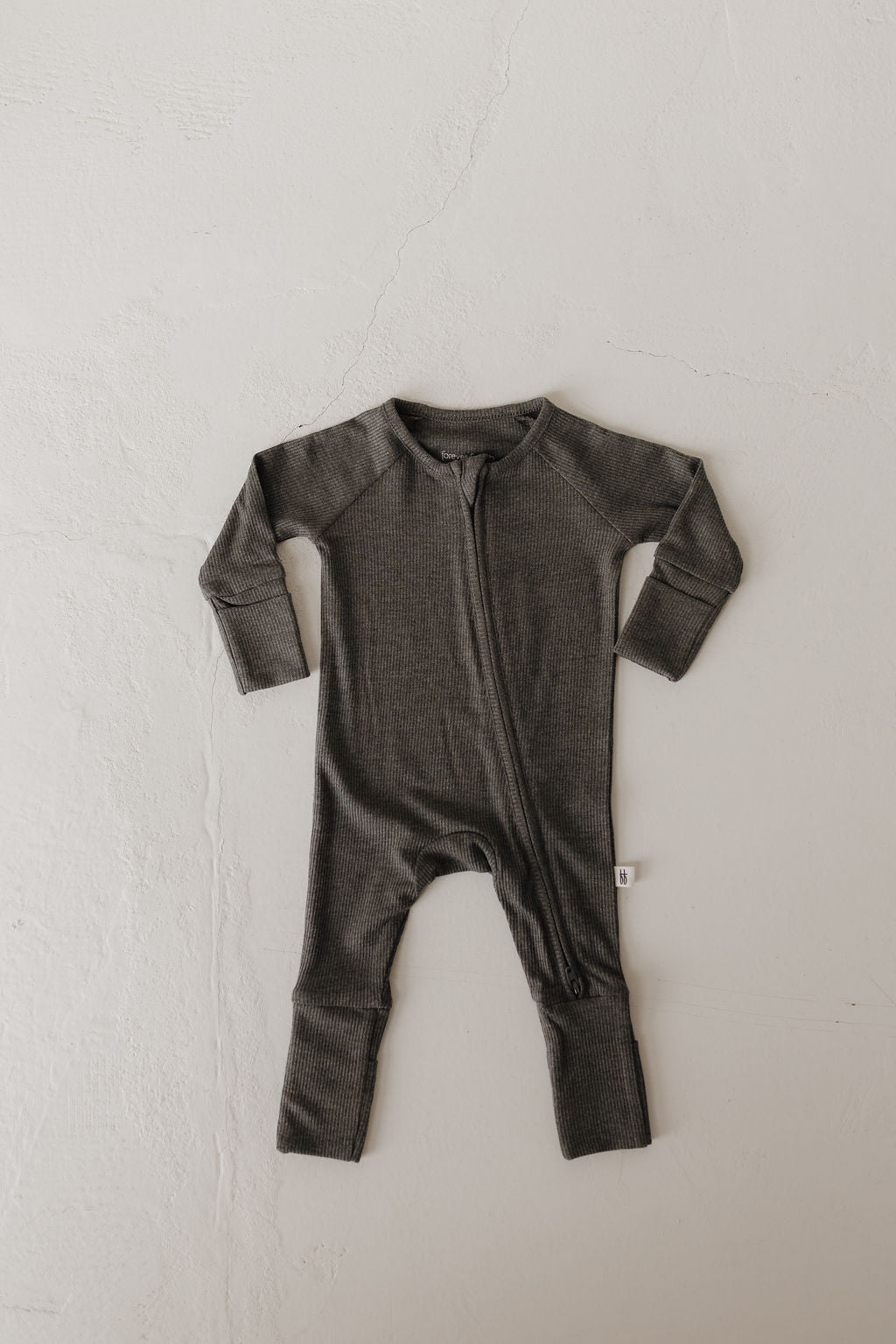 Bamboo baby pajamas in shadow grey with double zipper for easy diaper changes.