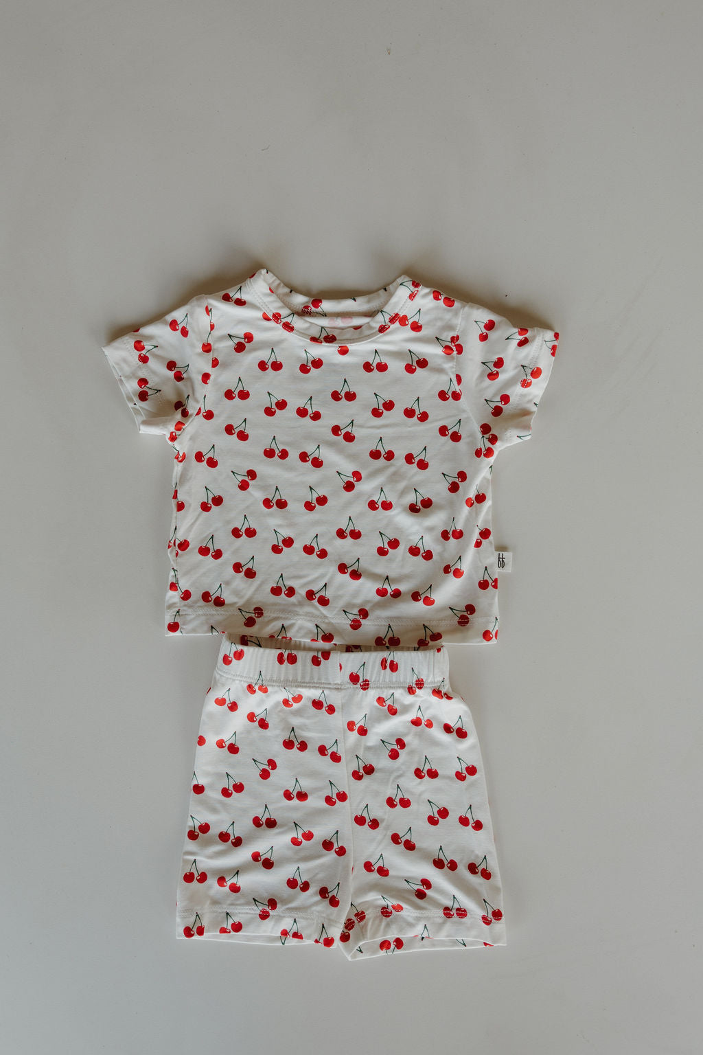 Bamboo short set featuring a cherry print tee and matching shorts, perfect for summer comfort and play.