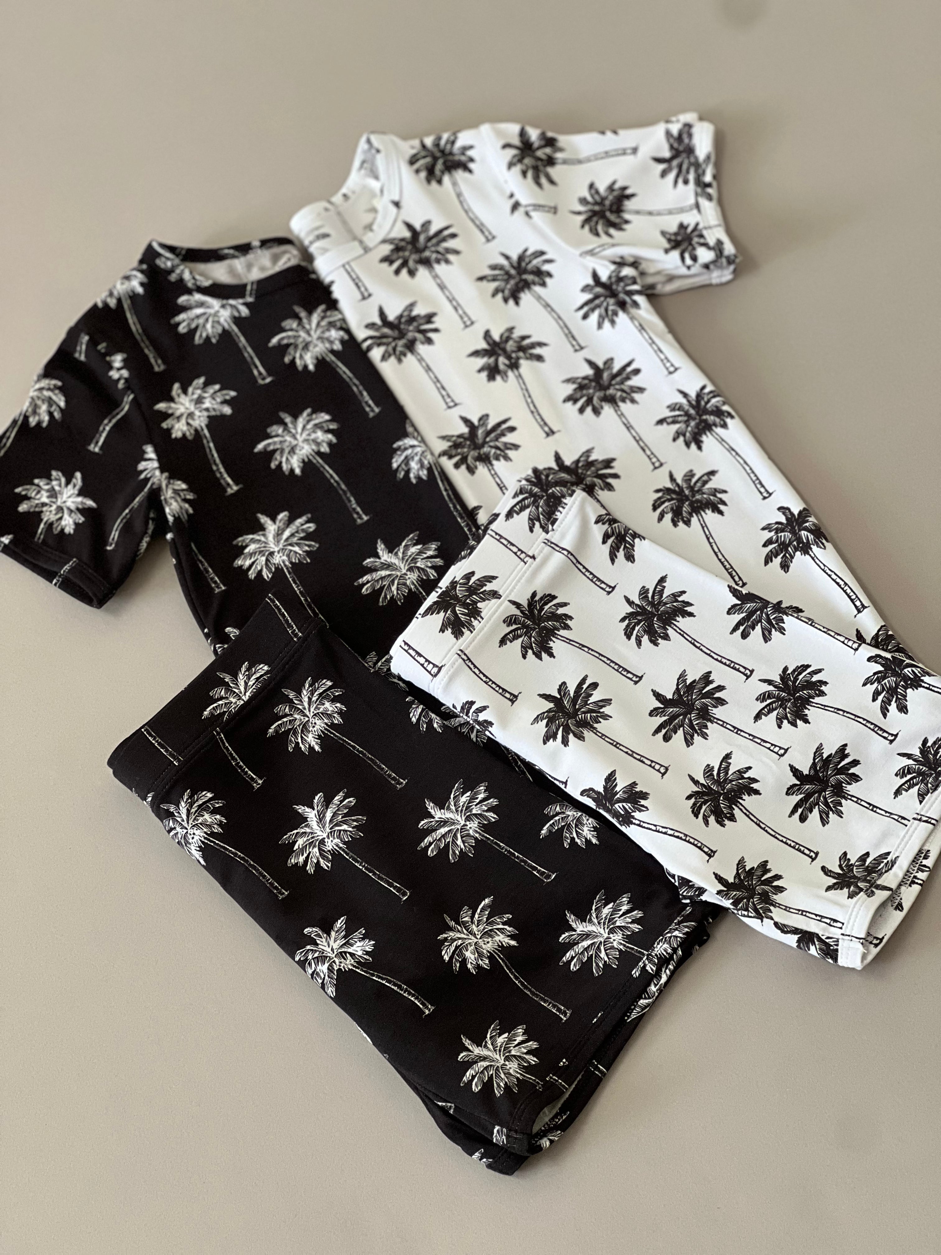 Bamboo shorts set featuring palm print in black and white for little ones, ideal for warm-weather play.