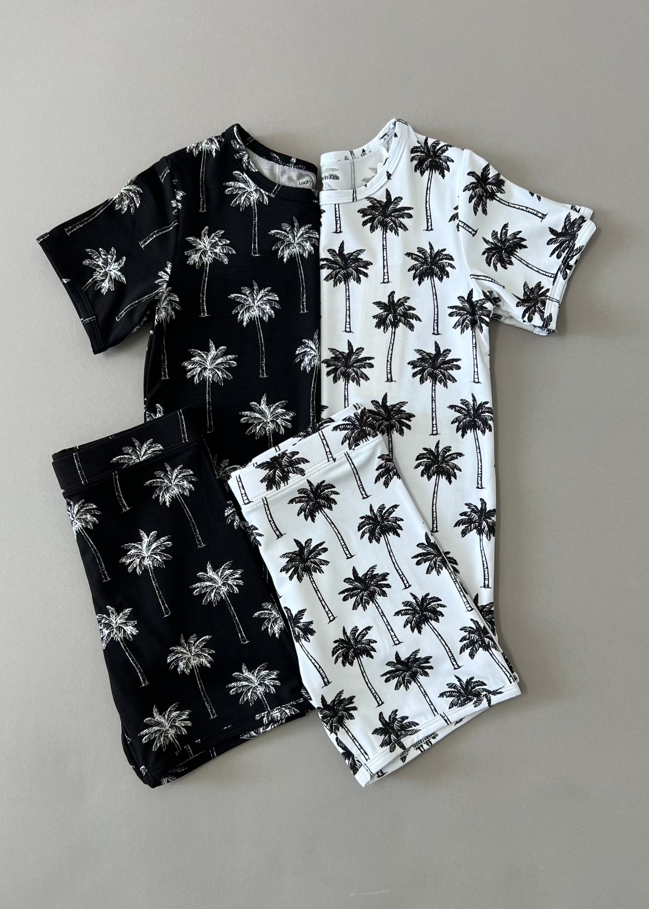 Bamboo shorts set featuring black and white palm print for baby and toddler summer outfits.