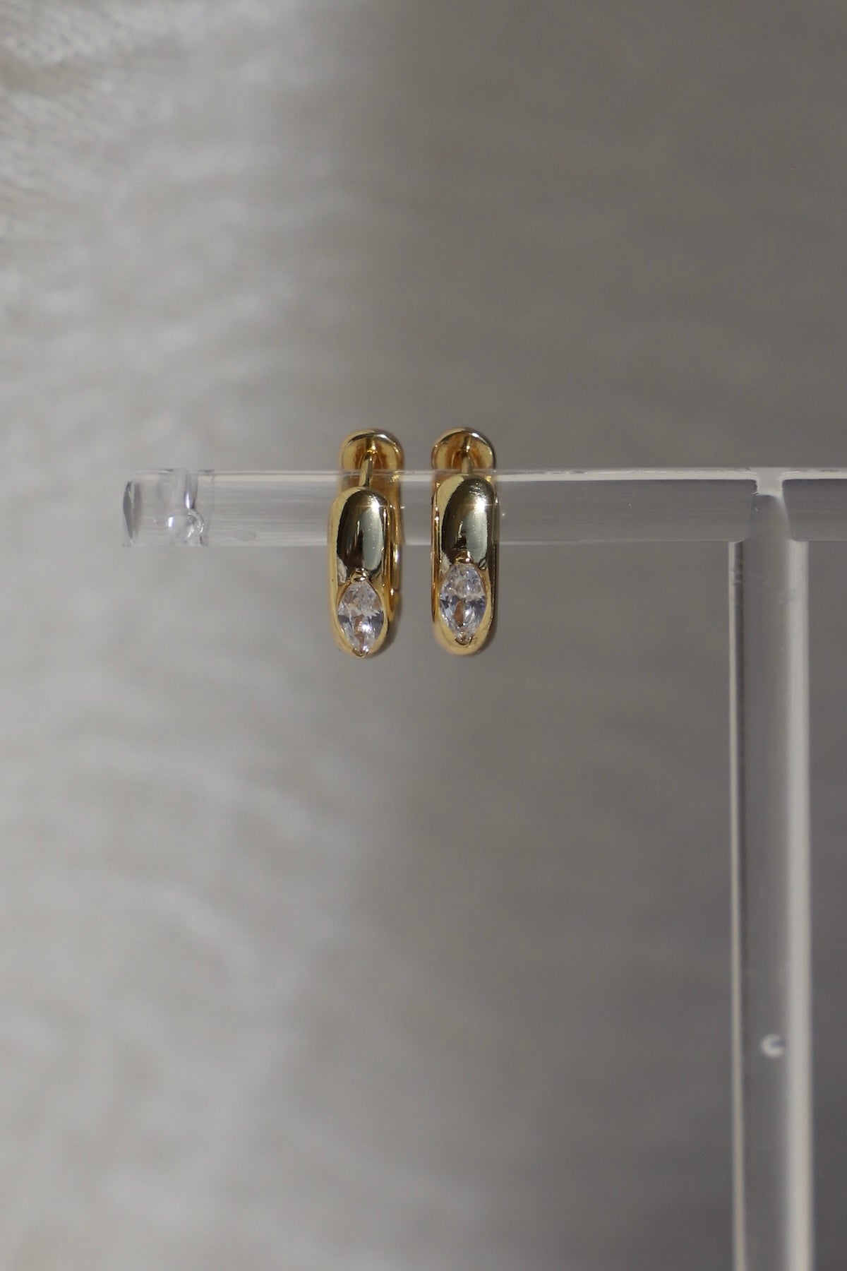 Aurum Hoops gold-toned earrings with sparkling accents, perfect everyday accessory for chic style.