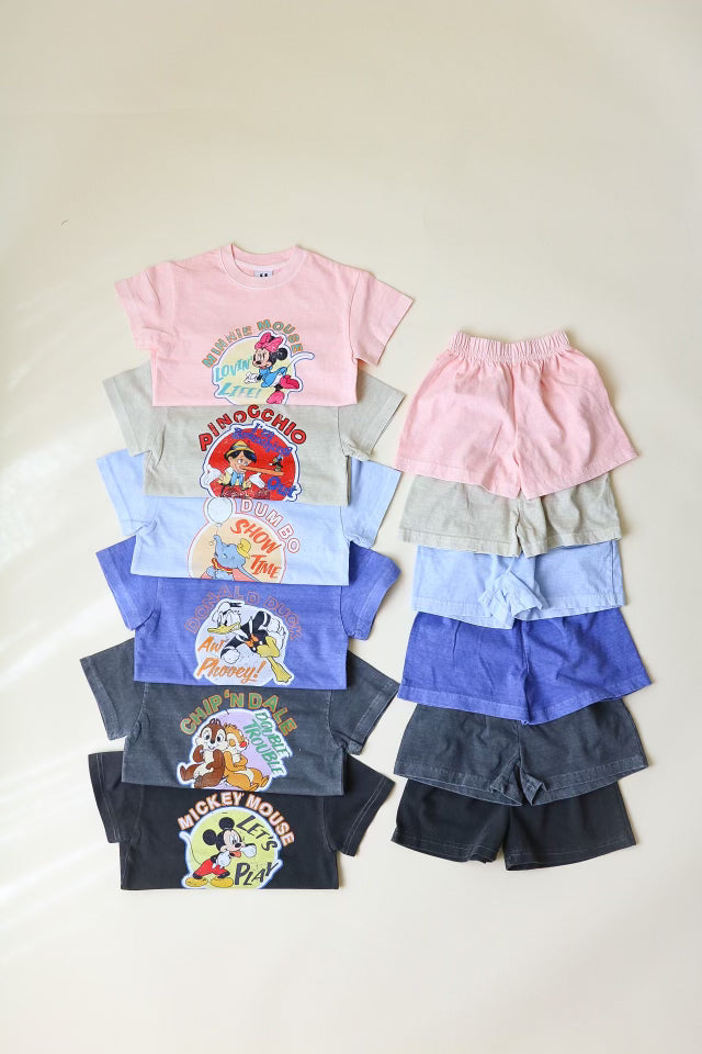 Mickey Friends Vintage Set featuring colorful T-shirts and shorts, perfect for kids' playtime, showcasing beloved Disney characters.