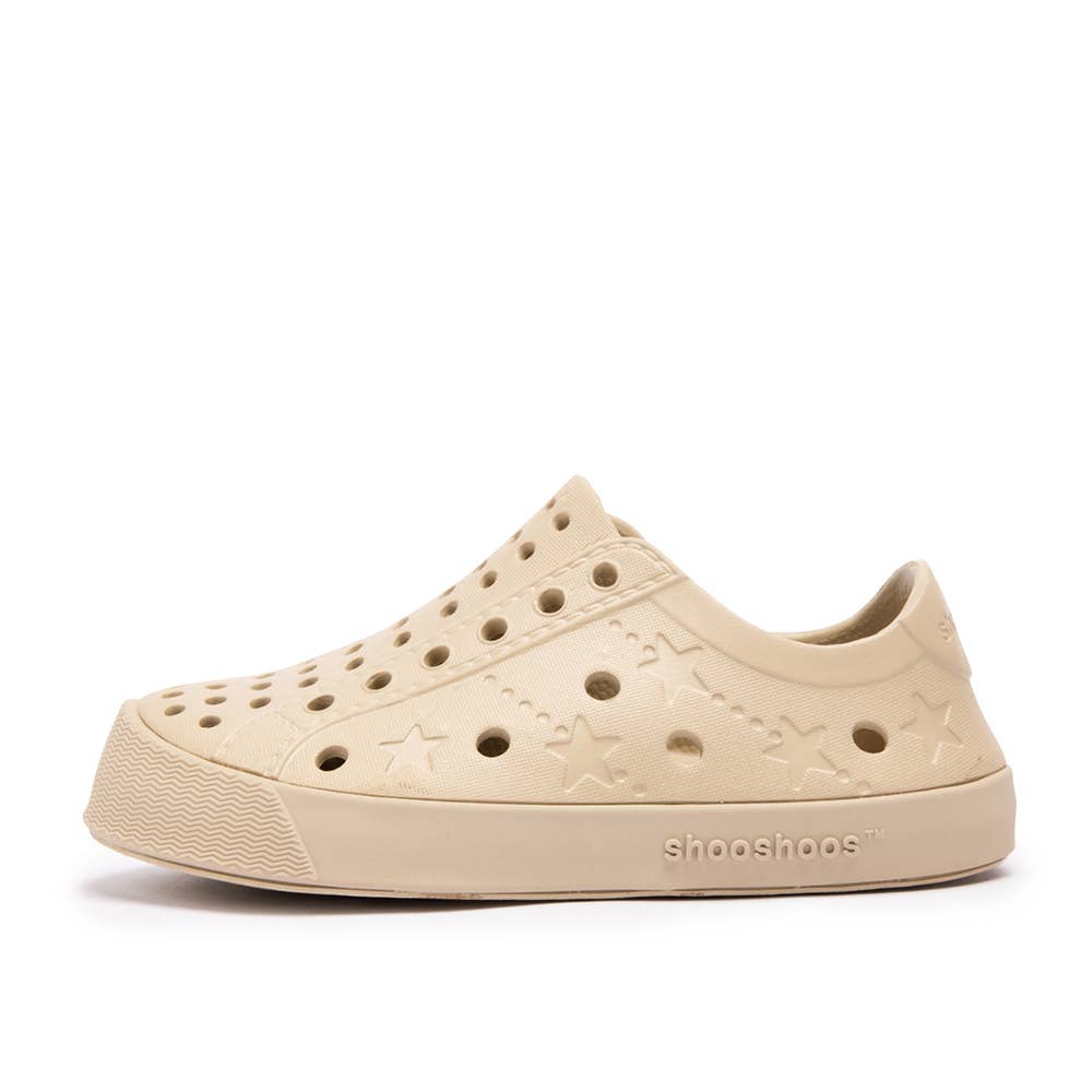 Lightweight beige Shooshoos toddler sneakers with star design and ventilation holes, perfect for summer adventures.
