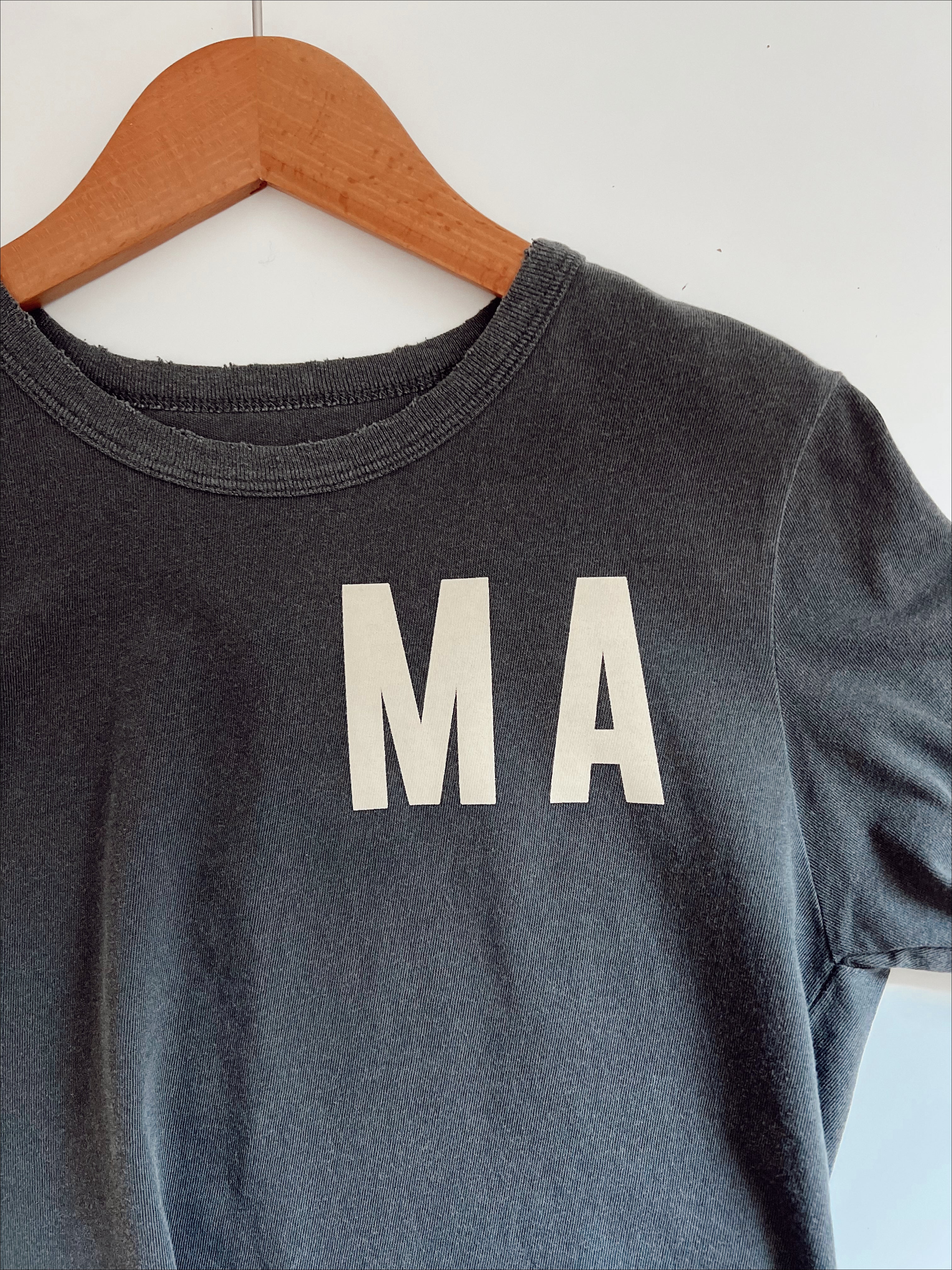 Close-up of the Organic Vintage MA Tee showing the oversized fit and vintage-style print.
