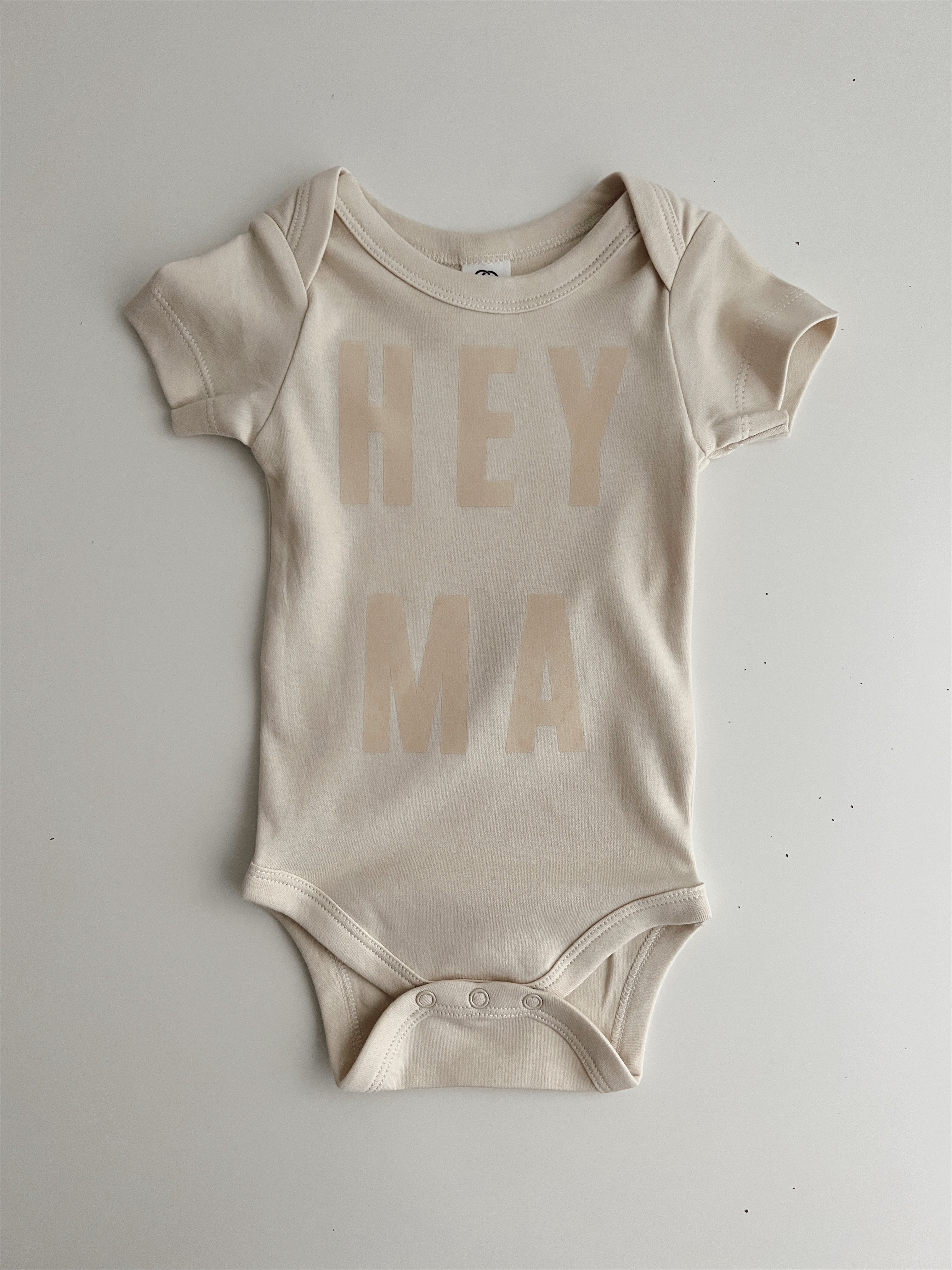Hey Ma Organic Onesie in cream, soft cotton fabric, perfect for trendy, ethically made baby clothes.